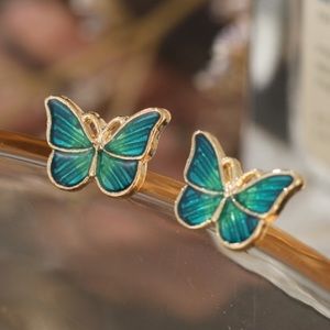 Butterfly boutique emerald colored inset earrings new